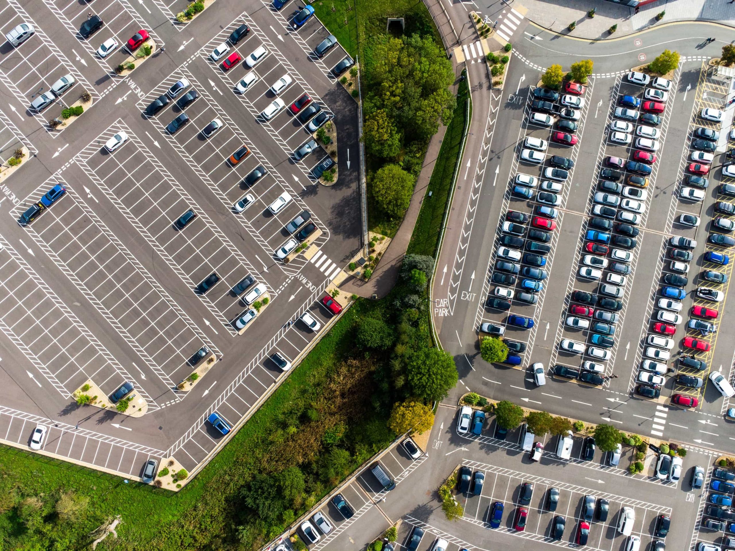 arial shot of carpark, looking down on cars